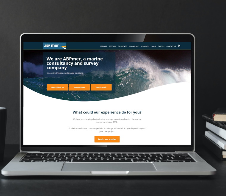 A laptop showing the abpmer.co.uk homepage 