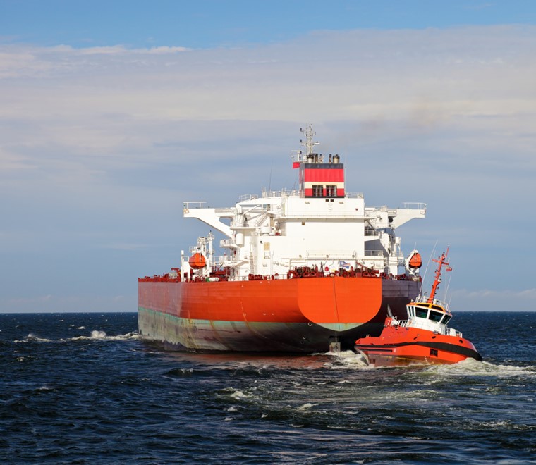 Escorting tanker by red tugs 